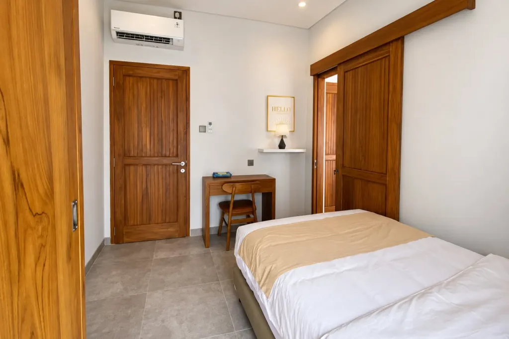 3BR villa for rent in Sanur — second bedroom with work desk and air conditioning
