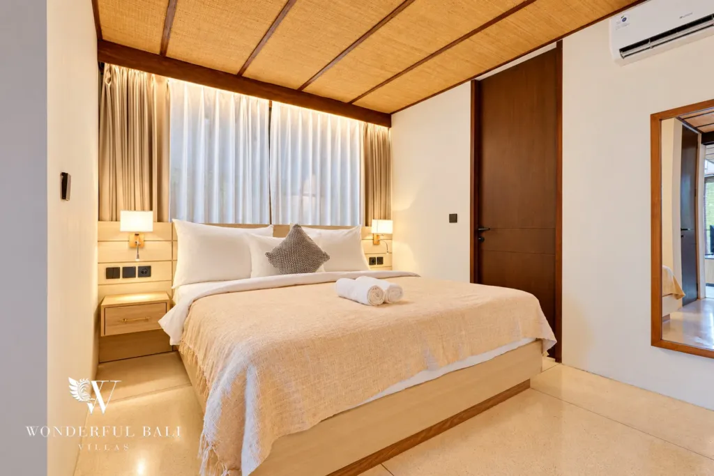 4BR villa for sale in Canggu — bedroom with lit headboard