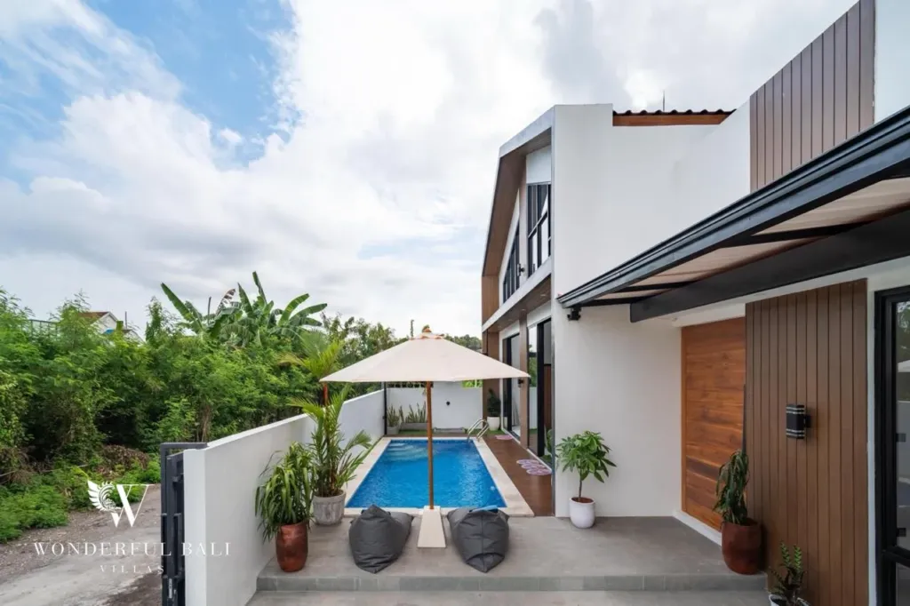3BR villa for sale in Saba, Gianyar — garden entrance with the pool and umbrella beyond