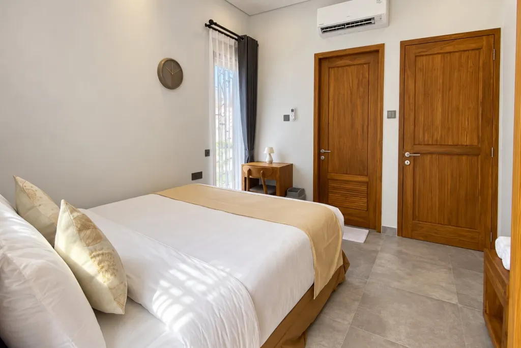3BR villa for rent in Sanur — third bedroom with desk and air conditioning