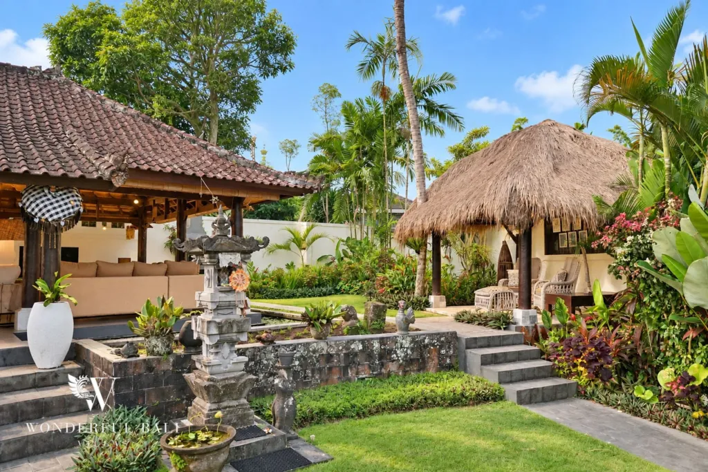 3BR villa for rent in Tabanan — pavilion, stone shrine and thatched gazebo in the garden