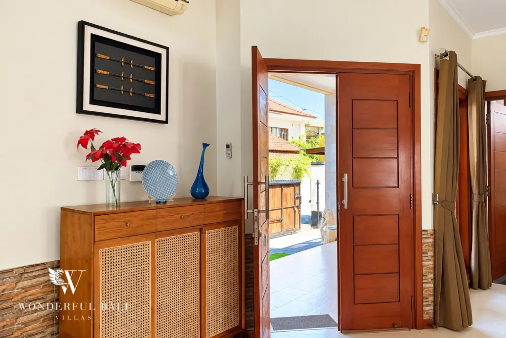 3BR villa for rent in Sanur — timber front door and entry console