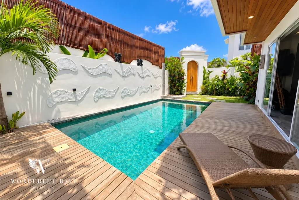 3BR villa for rent in Padonan — sun loungers on the deck beside the pool