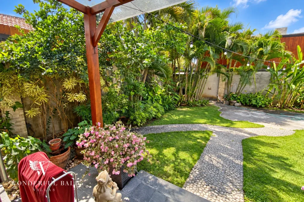 3BR villa for rent in Sanur — garden corner with flowering plants
