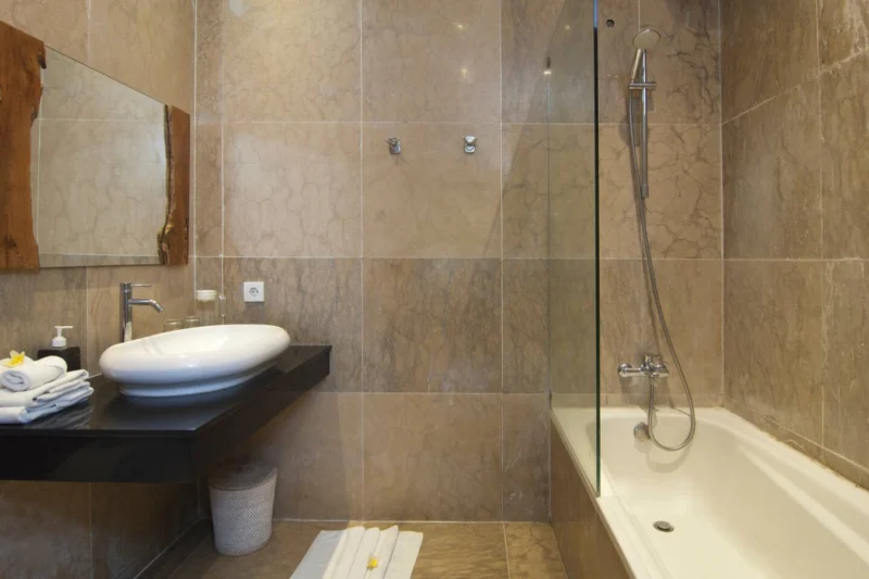 En-suite bathroom with wardrobe shower and bathtub