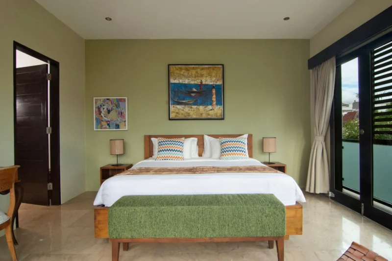 Second spacious bedroom upstairs with a comfortable king-size bed.