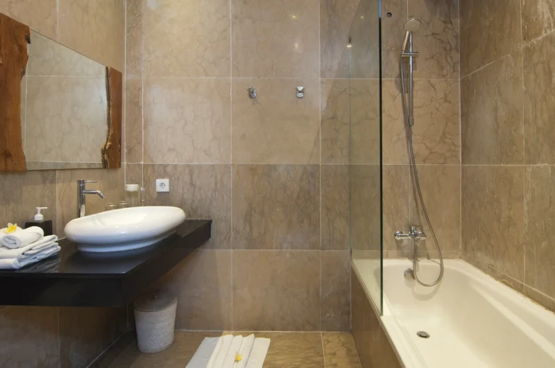 Guest bathroom with shower at Villa Casaneo Bali.