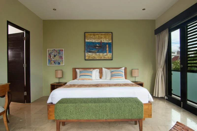 Second spacious bedroom upstairs with a comfortable king-size bed.