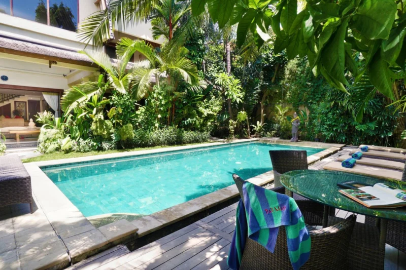 Poolside views with villa backdrop.