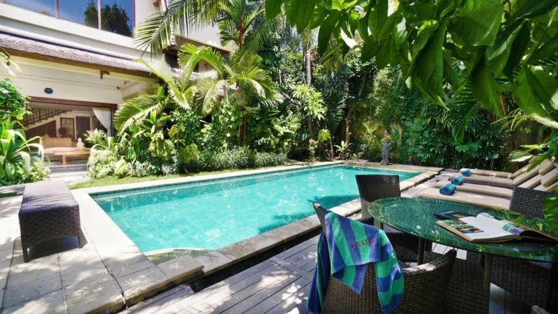 Poolside views with villa backdrop.