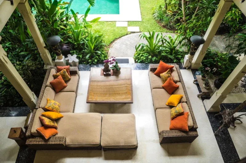 Poolside relaxation area at Villa Bali Maja in Petitenget Bali.