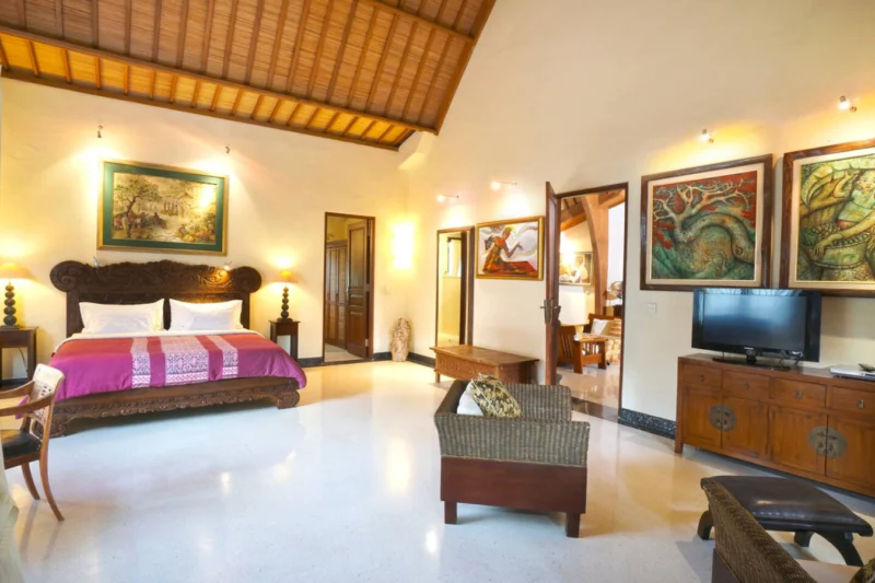 bedroom upstairs with seating area and TV