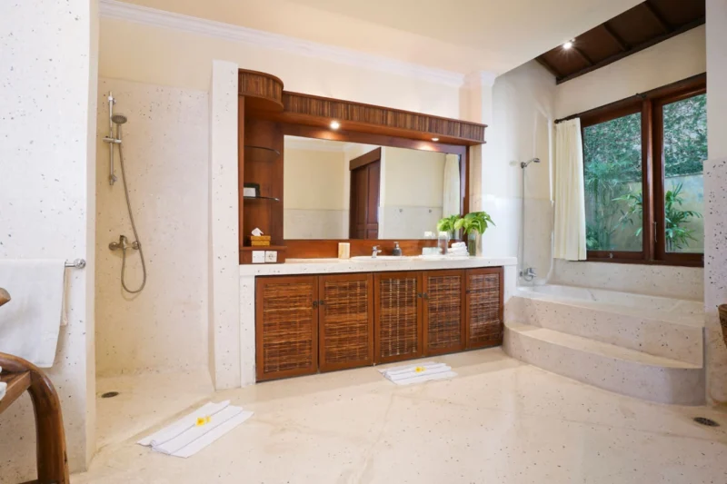 generously designed bathroom with garden view