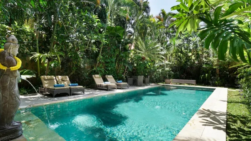 relax at the private pool in the spacious garden