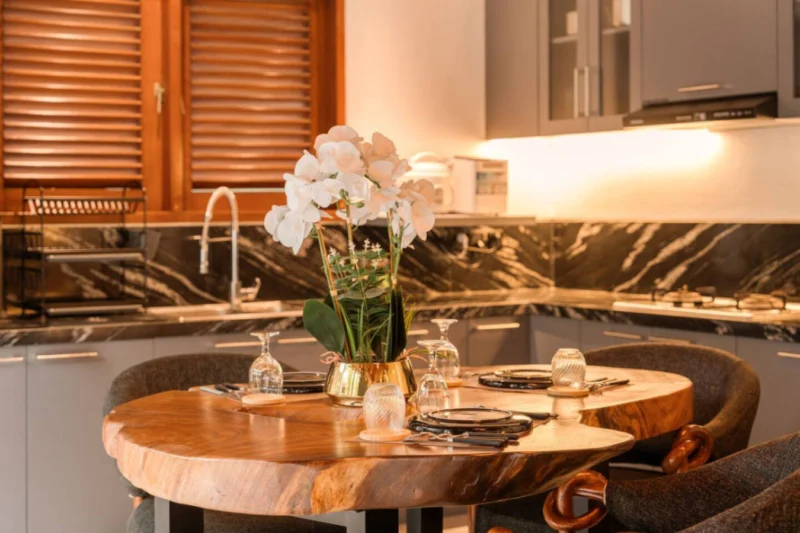 Fresh flowers on dark stone — one of the small daily touches that sets Villa 23 apart. The villa team manages the details. You manage how to spend the rest of the day.