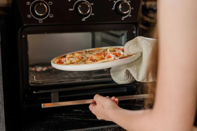 The convection oven with built-in air fryer handles pizza night as comfortably as it handles meal prep. Combined with the full hob, rice cooker, and Nespresso machine, this is a kitchen set up for guests who actually want to cook — not just store leftover